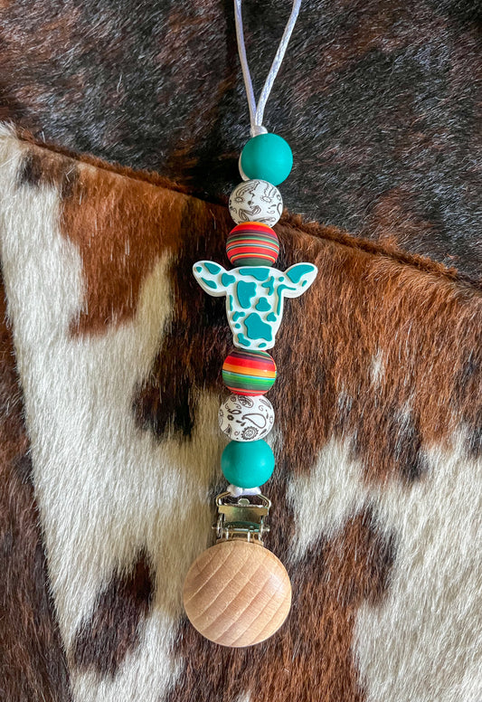 Turquoise Cow Pacifier Clip